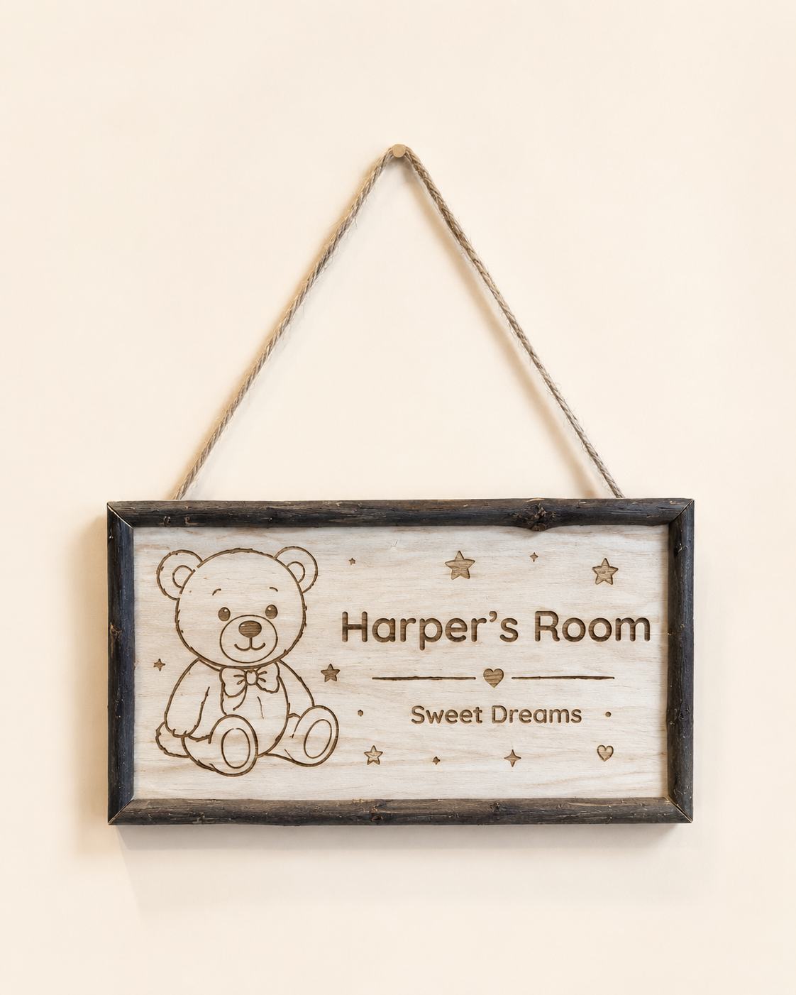 Personalized framed wooden nursery name sign hanging by jute rope