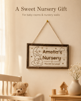 Personalized nursery name sign displayed in a warm neutral baby room