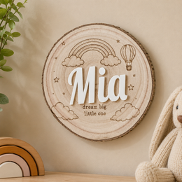 Personalized wooden nursery name sign with raised acrylic letters and engraved line art