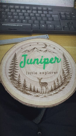 Video showing personalized wood slice nursery name sign with engraved design and acrylic name